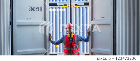Foreman or worker work at Container cargo site check up goods in container. 123472236