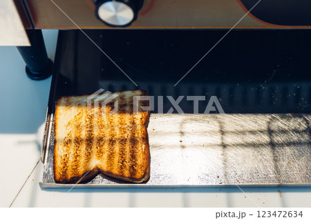 Bread from electrical Conveyor Toaster Oven toasting Bread from electrical Conveyor Toaster Oven toasting 123472634