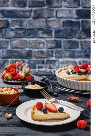 Berry tart with marzipan crust and vegan filling Berry tart with marzipan crust and vegan filling 123473057
