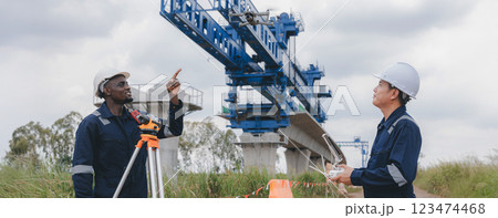 Engineer surveyor team Use drone for operator inspecting and survey construction site. 123474468