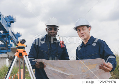 Engineer surveyor team Use drone for operator inspecting and survey construction site. 123474470