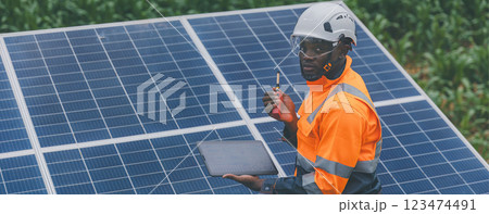 Engineer Checking solar panels in agriculture farm land. Engineer Checking solar panels in agriculture farm land. 123474491