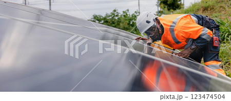 Engineer Checking solar panels in agriculture farm land. 123474504