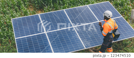 Engineer Checking solar panels in agriculture farm land. Engineer Checking solar panels in agriculture farm land. 123474510