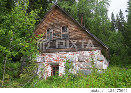 Stone bathhouse among trees on a mountainside 123475645