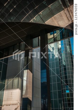 modern architecture showcases sleek lines and reflective surfaces in urban environment modern architecture showcases sleek lines and reflective surfaces in urban environment 123476059