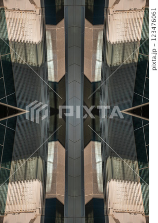 Geometric patterns created by reflections on modern glass buildings in an urban setting during the early afternoon 123476061
