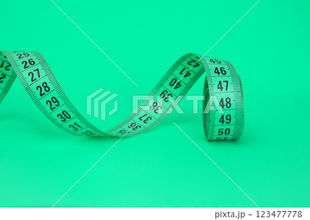 Tape measure sew diet colorful isolated on the white background Tape measure sew diet colorful isolated on the white background 123477778