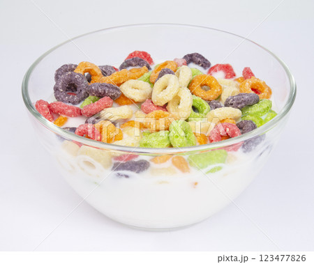 colored breakfast cereals laid out in a bowl on the white background top view, children's healthy breakfast 123477826