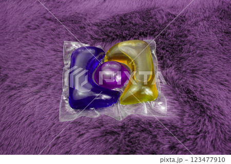 Washing gel capsule on material textile background 123477910
