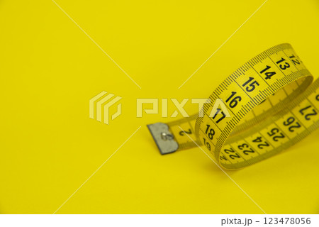 Tape measure sew diet colorful background with copyspace Tape measure sew diet colorful background with copyspace 123478056