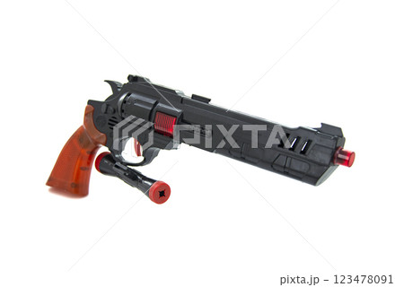 Toy gun black pistol for fun isolated on the white background 123478091