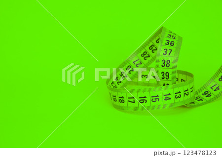 Tape measure sew diet colorful background with copyspace Tape measure sew diet colorful background with copyspace 123478123