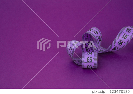 Colorful tape measure spiral with copyspace background Colorful tape measure spiral with copyspace background 123478189
