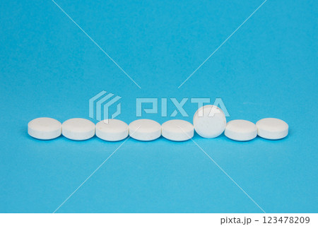 White pills antibiotic round on blue background White pills antibiotic round on blue background 123478209
