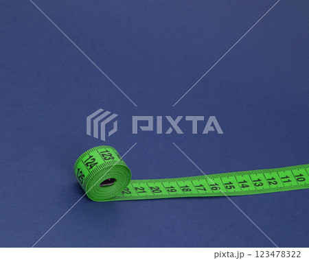 Colorful tape measure spiral with copyspace background 123478322
