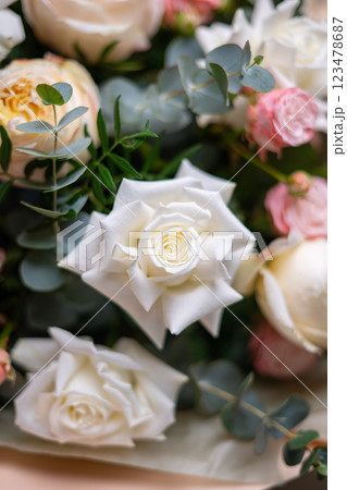 Delicate composition of white and pink roses in a basket Delicate composition of white and pink roses in a basket 123478687