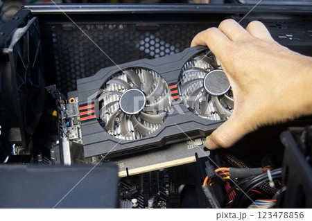 Technicians are assembling graphics cards, computer components. 123478856