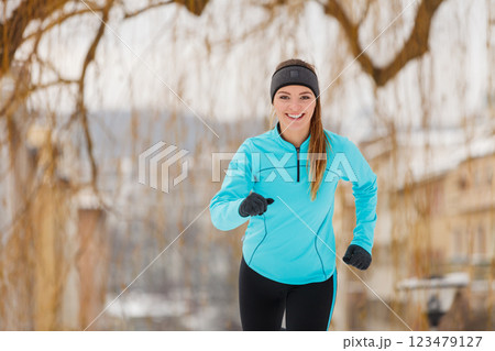 Winter sports, girl exercising in city Winter sports, girl exercising in city 123479127