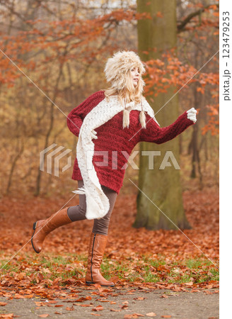 Fashion woman running in fall autumn park forest. 123479253