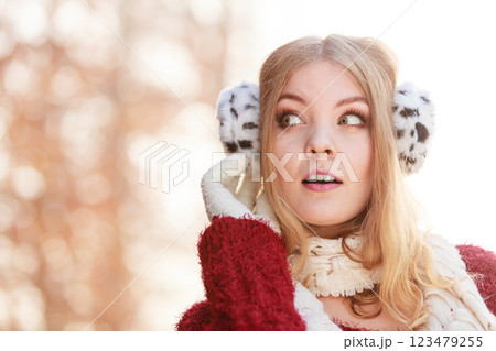 Portrait of pretty gorgeous woman in earmuffs. 123479255