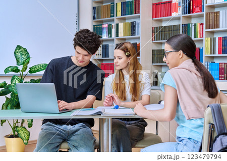 Group of college students are studying in library class 123479794