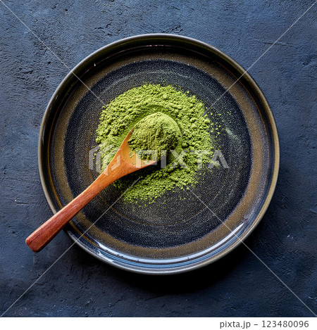 Rustic Matcha Powder on Dark Plate Rustic Matcha Powder on Dark Plate 123480096