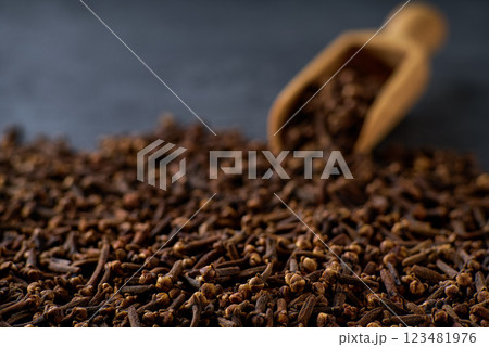 cloves spice on a black stone table, selective focus. 123481976