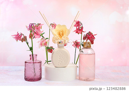 Spa and wellness composition, aromatic rose water, lilac incense sticks and aquilegia flowers. salon invitation and advertisement, aromatherapy and skin care, lifestyle and organic cosmetics concept, Spa and wellness composition, aromatic rose water, lilac incense sticks and aquilegia flowers. salon invitation and advertisement, aromatherapy and skin care, lifestyle and organic cosmetics concept, 123482886