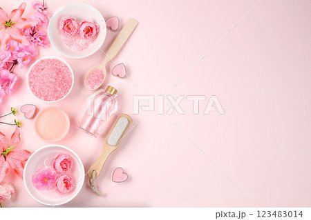 Spa and wellness composition with aromatic rose water, salt, roses, archidea flowers and sakura, aromatherapy and skin care, lifestyle concept, invitation and advertising, selective focus 123483014