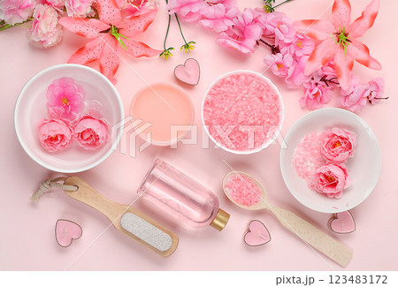 Spa and wellness composition with aromatic rose water, salt, roses, archidea flowers and sakura, aromatherapy and skin care, lifestyle concept, invitation and advertising, selective focus 123483172