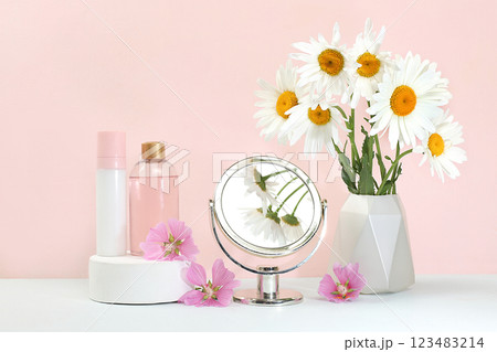 Spa and wellness composition with fragrant rose water and orchid and chamomile flowers, aromatherapy and skin care, lifestyle concept, salon invitation and advertisement, selective focus 123483214