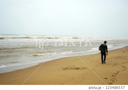 Lonely hawker at Puri sea beach during morning time 123486537
