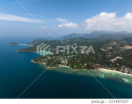 Tranquil coastline featuring turquoise water, lush greenery, and tropical surroundings. Ko Pha Ngan, Thailand. 123487027