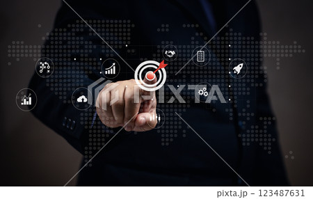 Man points at business target on virtual screen, strategy planning marketing for success in the future. Achievement teamwork and development leadership and competition Performance solution. Man points at business target on virtual screen, strategy planning marketing for success in the future. Achievement teamwork and development leadership and competition Performance solution. 123487631