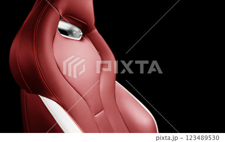 Red leather interior of the luxury modern car. Perforated red leather. Seats with stitching isolated on black background. Modern car interior details. Car inside 123489530