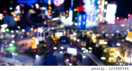 Blurred city aerial view from the view point. Blurred abstract background with night city. Abstract blurred bokeh lights city and road intersection. Blurred city aerial view from the view point. Blurred abstract background with night city. Abstract blurred bokeh lights city and road intersection. 123489544