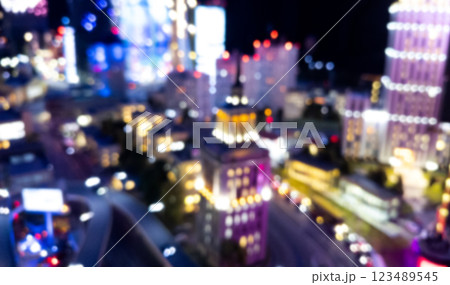 Blurred city aerial view from the view point. Blurred abstract background with night city. Abstract blurred bokeh lights city and road intersection. Blurred city aerial view from the view point. Blurred abstract background with night city. Abstract blurred bokeh lights city and road intersection. 123489545