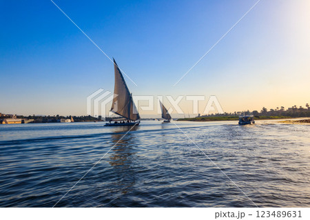 Felucca boats sailing on the Nile river in Luxor, Egypt. Traditional Egyptian sailing boats Felucca boats sailing on the Nile river in Luxor, Egypt. Traditional Egyptian sailing boats 123489631