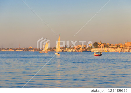 Felucca boats sailing on the Nile river in Luxor, Egypt. Traditional Egyptian sailing boats Felucca boats sailing on the Nile river in Luxor, Egypt. Traditional Egyptian sailing boats 123489633