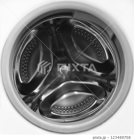 Washing machine drum close up. Washing machine background. Inside the washing machine. Metal washing machine drum. Washing machine drum close up. Washing machine background. Inside the washing machine. Metal washing machine drum. 123489708