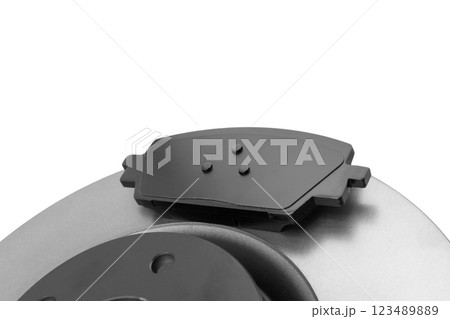 Brake discs and brake pads isolated on white background. Auto parts. Brake disc rotor isolated on white. Braking disk. Car part. Quality spare parts for car service or maintenance Brake discs and brake pads isolated on white background. Auto parts. Brake disc rotor isolated on white. Braking disk. Car part. Quality spare parts for car service or maintenance 123489889