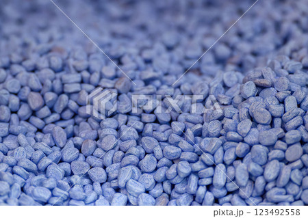 The pile of blue pellets materials for plastic injection process. The pile of blue pellets materials for plastic injection process. 123492558