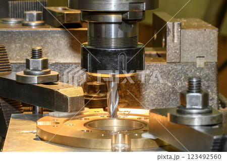 The hole boring  process the brass material parts on NC milling machine with flat end mill tools. 123492560