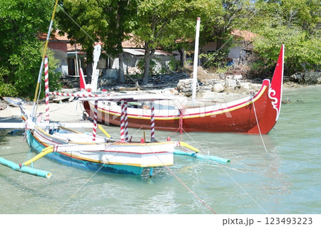Colorful Fishing Boats Floating on the Sea Colorful Fishing Boats Floating on the Sea 123493223