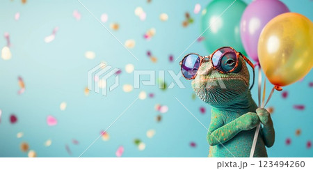 lizard with glasses and balloons on a blue background 123494260