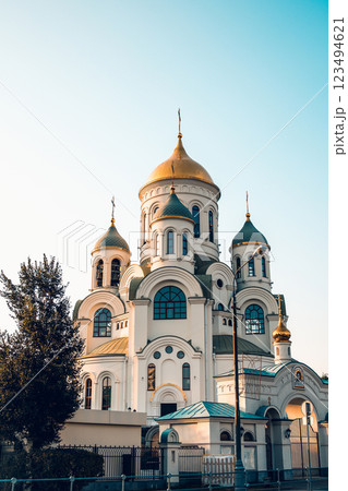 Orthodox church with golden domes. Church Golden sunset. Place of worship of God. Shining domes of the church. Orthodox church with golden domes. Church Golden sunset. Place of worship of God. Shining domes of the church. 123494621