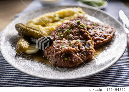Inverted Beef Schnitzel with Mashed Potatoes and Pickled Cucumbers. Traditional Czech and Slovak Food 123494832