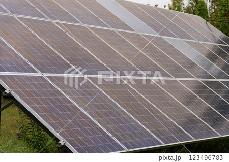 Rooftop solar panels capture sunlight, converting it into clean electricity. This setup utilizes photovoltaic technology to generate renewable energy efficiently 123496783