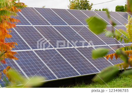 Solar panels are installed on a rooftop, effectively capturing sunlight to generate electricity. The clear blue sky enhances the efficiency of this renewable energy source Solar panels are installed on a rooftop, effectively capturing sunlight to generate electricity. The clear blue sky enhances the efficiency of this renewable energy source 123496785